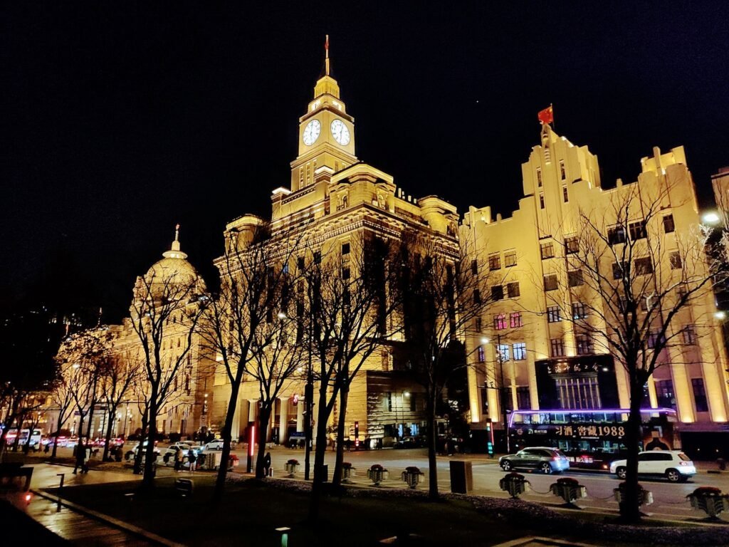 Photograph of Shanghai Chartered Bank Building at night.